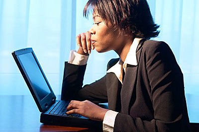 Woman using laptop uid 1344248