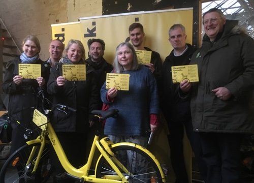 Martin Phipps (3rd from right) with Natalie Bennett and Green councillors and activists with Ofo bike